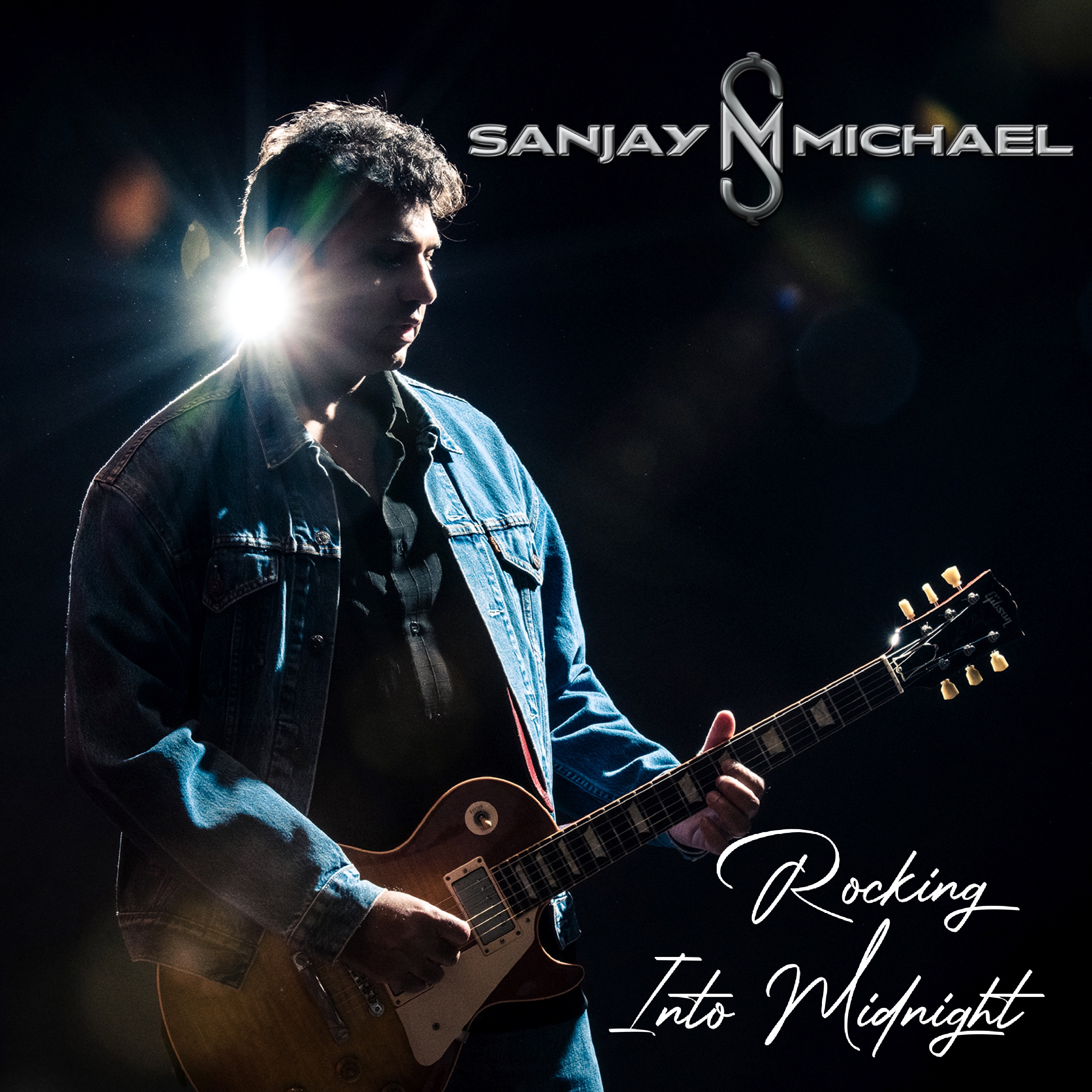 Sanjay Michael’s Rocking Into Midnight: Am array of compelling electric guitar riffs.