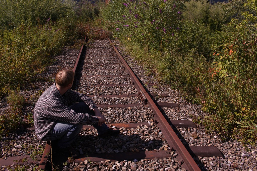 Man, Track, Railway, Train, Grass, Green, Shirt, Music, Musician, Flannel, Jeans, Shoes, Stones, Song, Artist, Rock