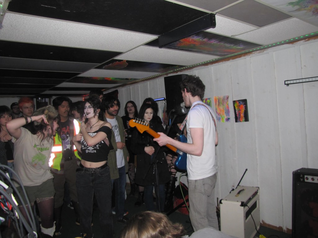 Man, Band, Guitar, Rock, Party, Basement, House, Speaker, Makeup, Walls, Album, Song